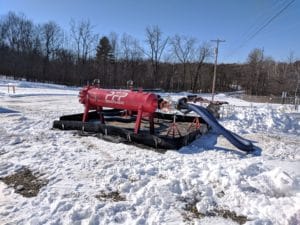 Pre-filter particulate vessel in snowy environment with cargo hose attached for fuel or fluid filtration