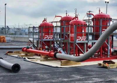 Two filter flushing skid rental units operating on site at an airport for large-scale fuel or fluid system cleaning