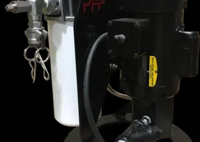 Back view of handheld filter unit showing compact frame, rear connections, and carry handle