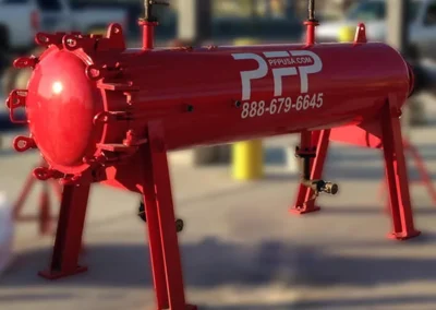 Horizontal pre-filter vessel in use at an industrial site for high-volume particulate filtration