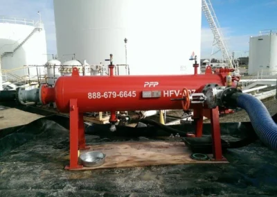 High flow filter vessel on site with inlet and outlet hoses connected for active fluid filtration