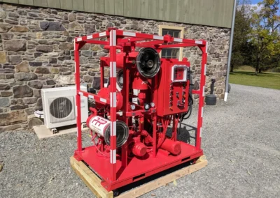 Side view of 50 GPM vacuum dehydrator showing filter housings, frame structure, and access panels