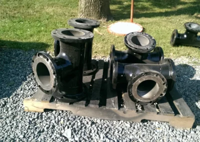 Pipe fitting tees used in PFP rental filtration systems to split or redirect fluid flow