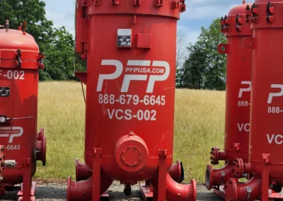 Vertical coalescer separator vessels lined up at Precision Filtration Products storage facility, available for rental deployment