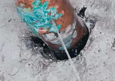 Corroded metal pipe showing damage from acidic fluid exposure, used to illustrate need for Acid Shield protection