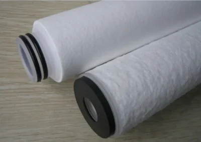 End caps on meltblown filter cartridges for secure sealing in liquid filtration housings
